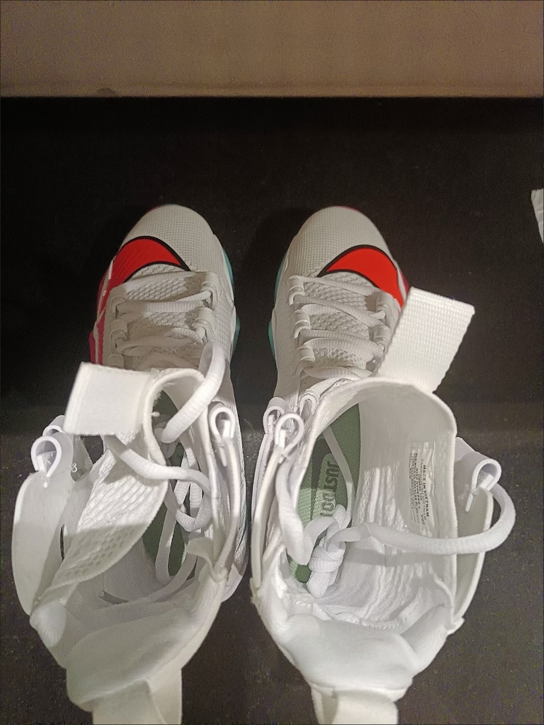 Buyer photo: pair of white Nike HyperKO 2 shoes, top view