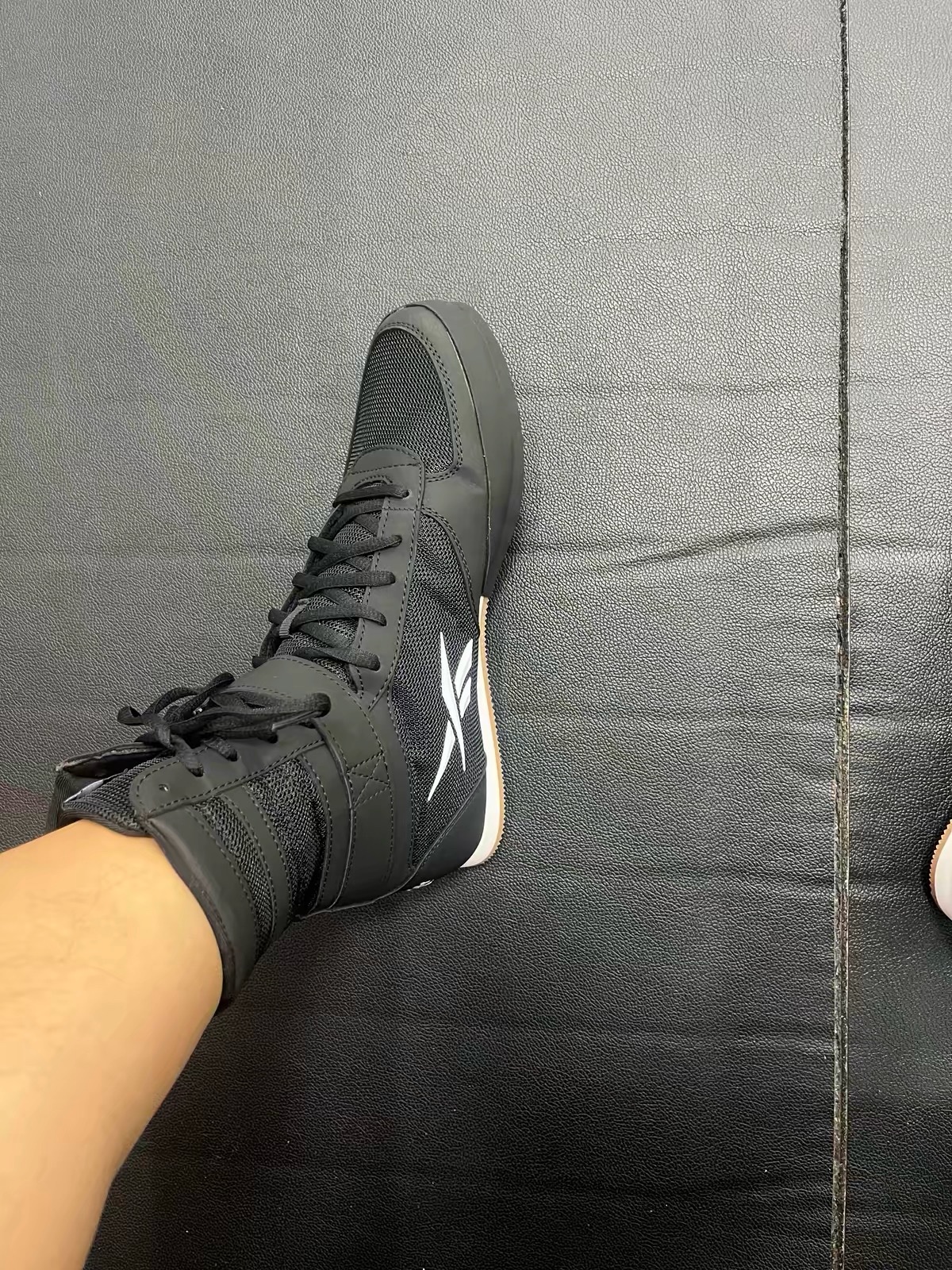 Buyer photo: black Reebok boxing boots worn on foot